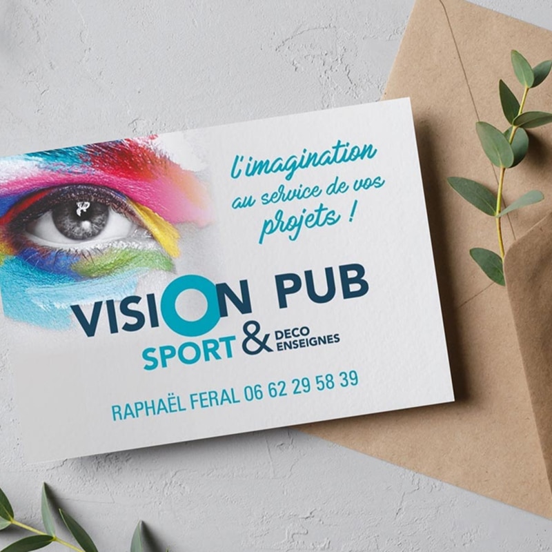 Carte de visite Vision Pub Sport & Déco Enseignes. Oeil coloré. Texte: L'imagination au service de vos projets ! Raphaël Feral 06 62 29 58 39.
